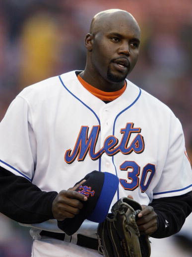 Jul 10, 2004; Miami, FL, USA; New York Mets' left fielder CLIFF FLOYD flies  out to left field in the 7th inning during the New York Mets v.Florida Marlins  baseball game, Saturday